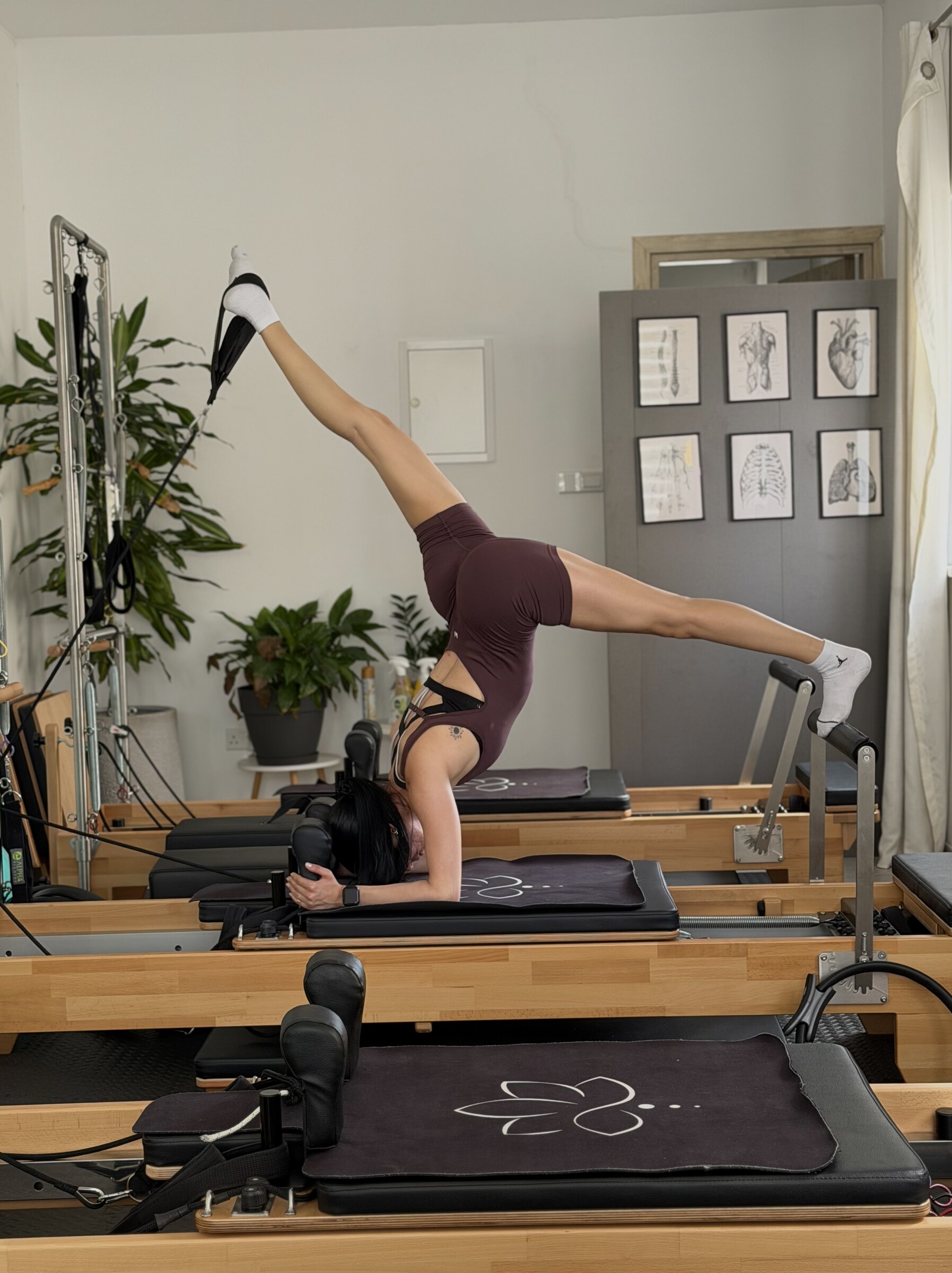 Auroralia instructor on the Pilates reformer